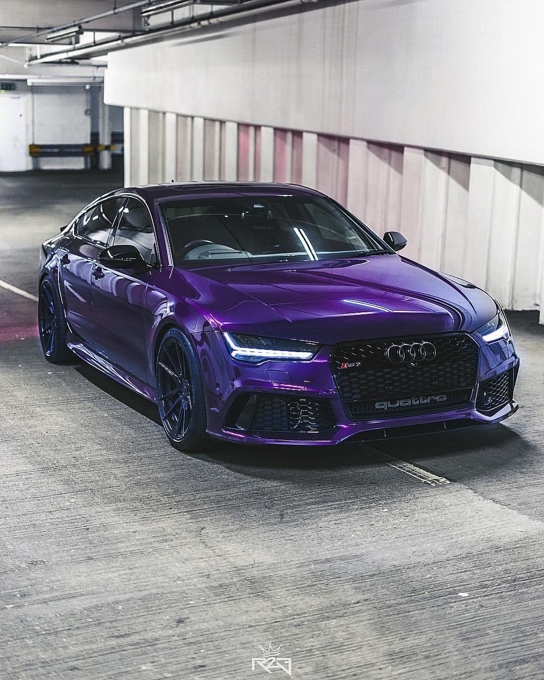 Audi RS silhouette in Midnight Purple Metallic, three-quarter front view in a concrete garage